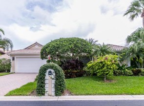 Home with arched hedge entry at 3380 Southern Cay Dr