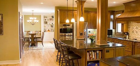 Remodeled kitchen with wood cabinetry and island