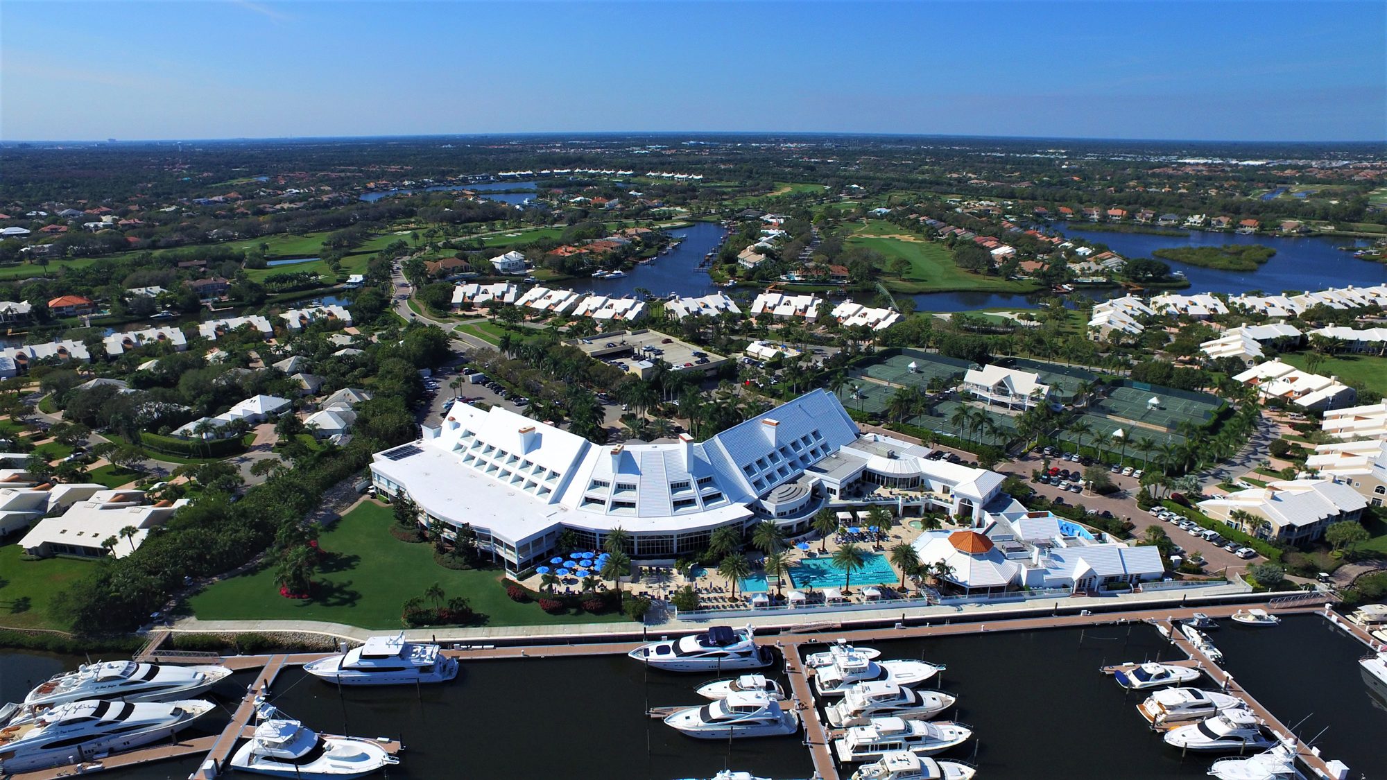 Admirals Cove golf holes winding around lakes with the ocean on the horizon