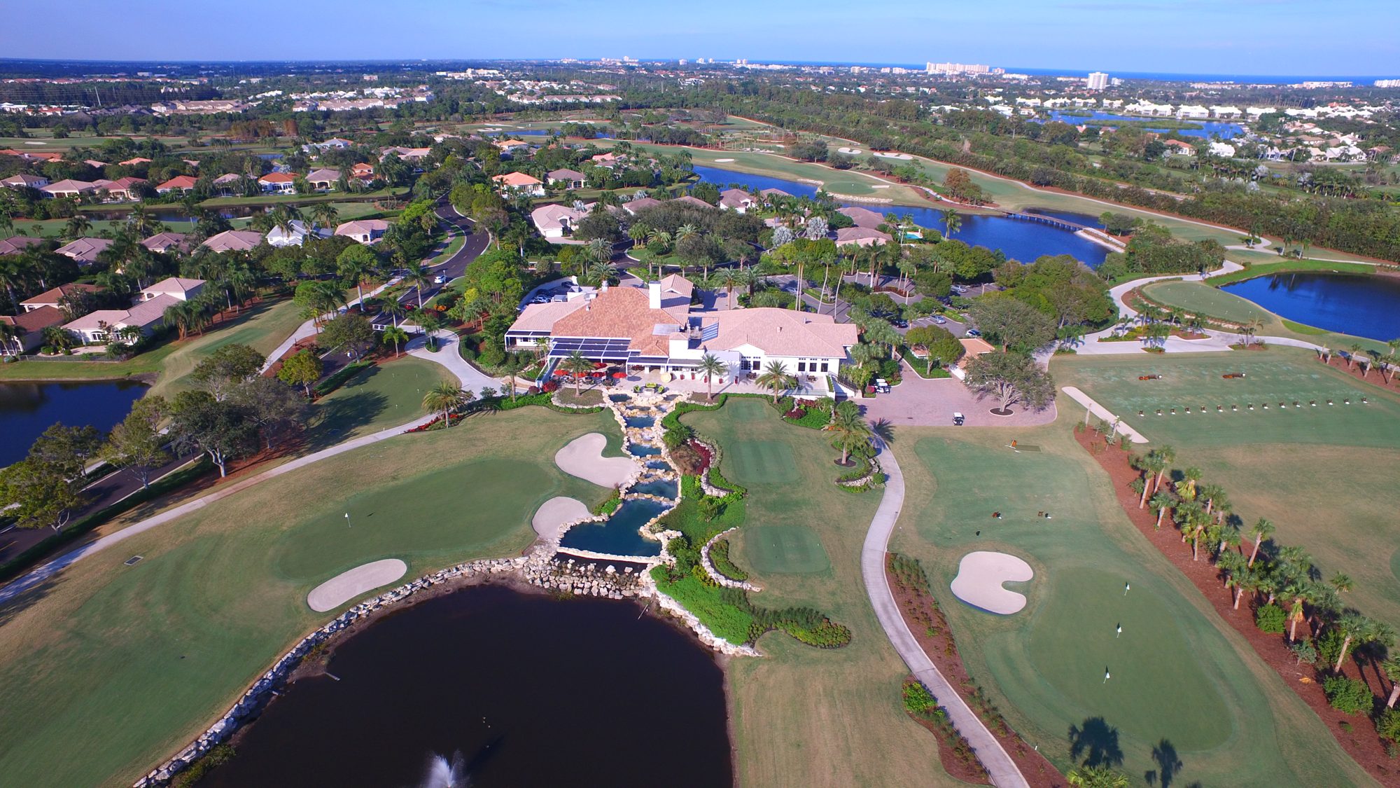 The Admirals Cove marina full of yachts, with waterfront homes and the Intracoastal beyond