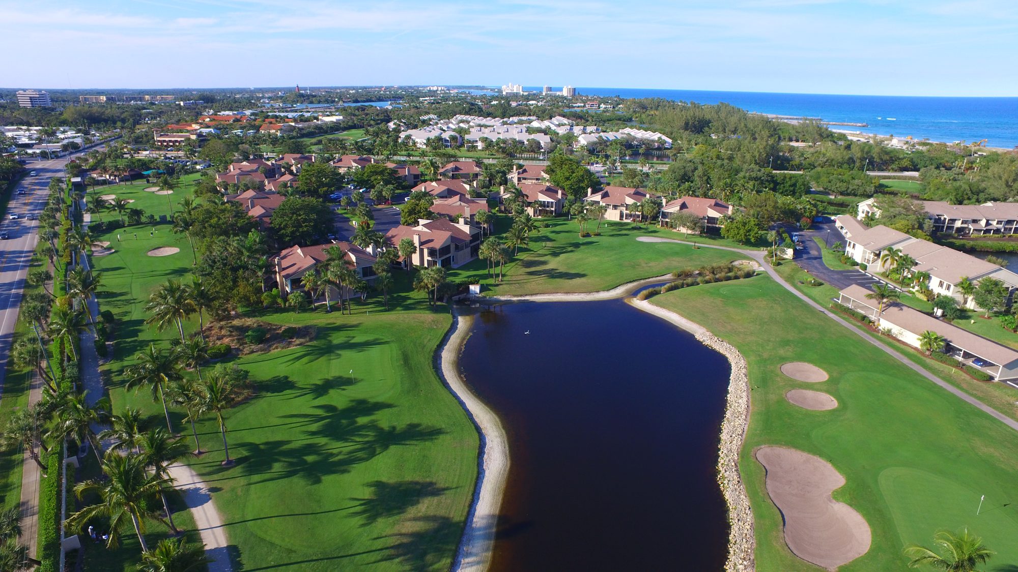 The Estuary condominiums with the Jupiter Inlet and beach beyond