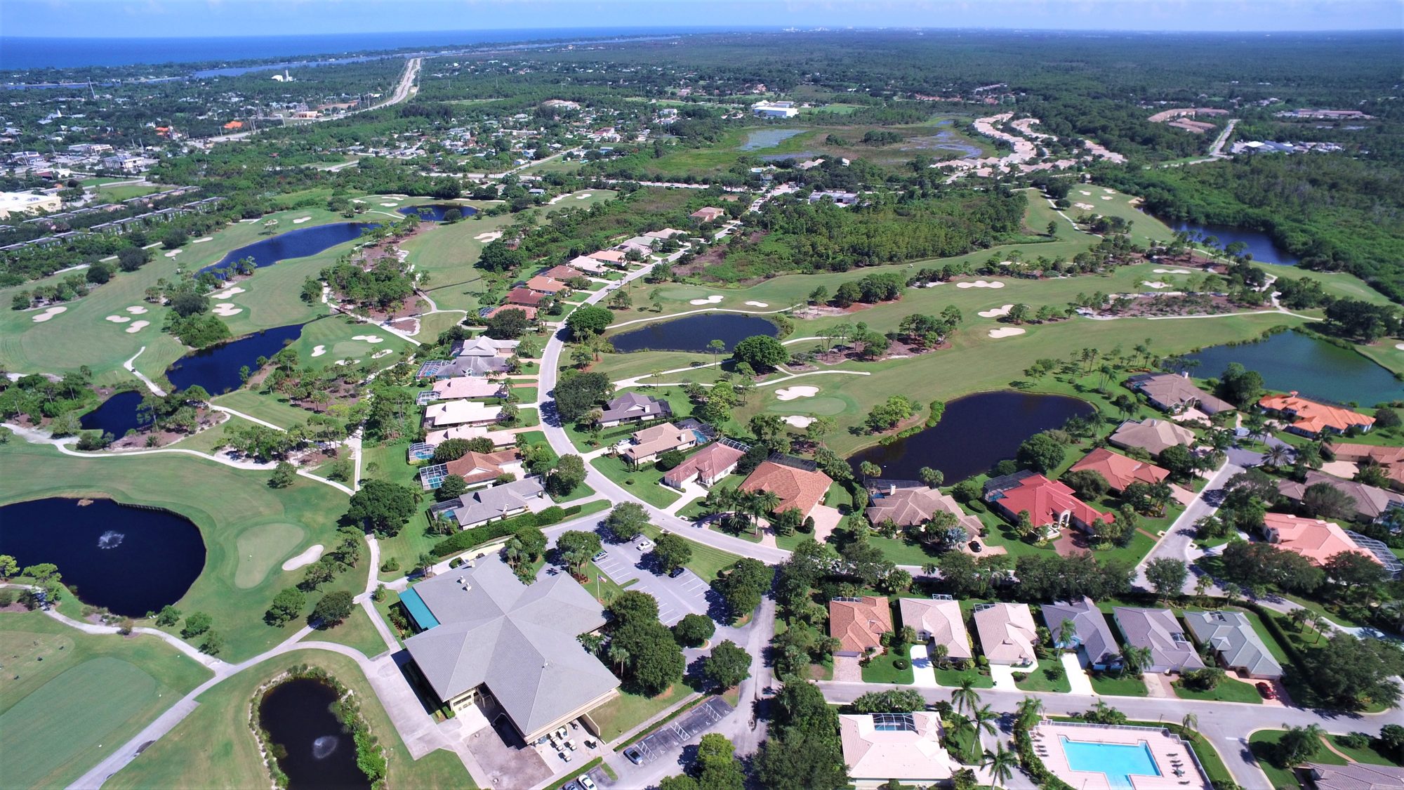 Hobe Sound Golf Club fairways and lakes beside homes and the preserve