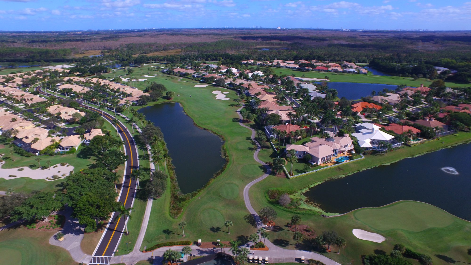 An Ibis golf hole between lakes and homes