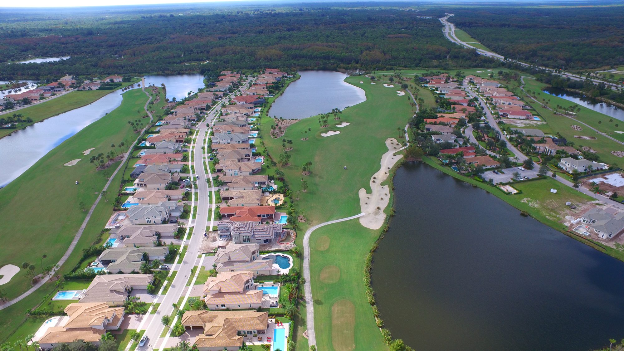 Homes lining a Jupiter Country Club fairway and lake