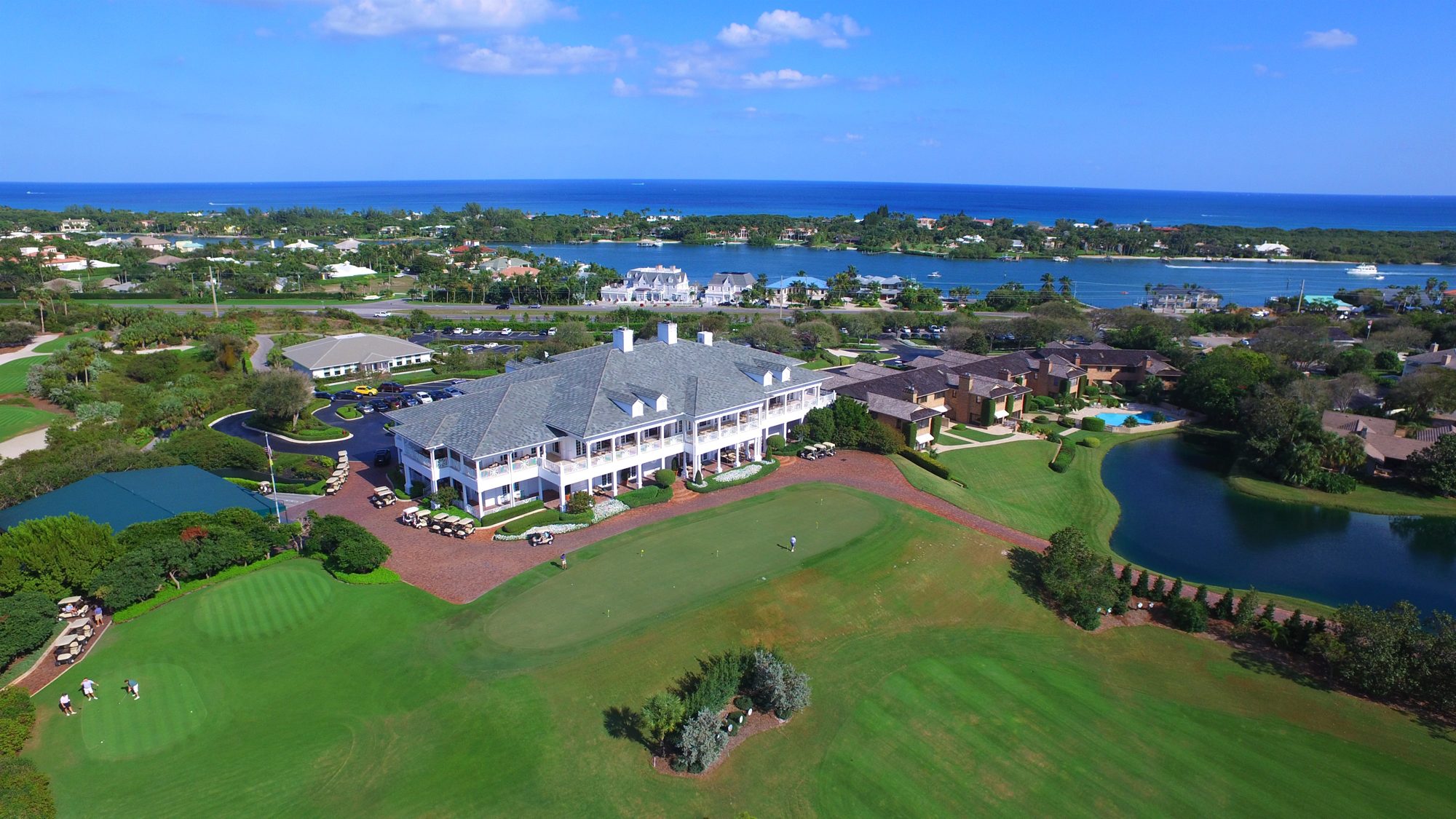 The Jupiter Hills clubhouse with the Intracoastal and the ocean beyond