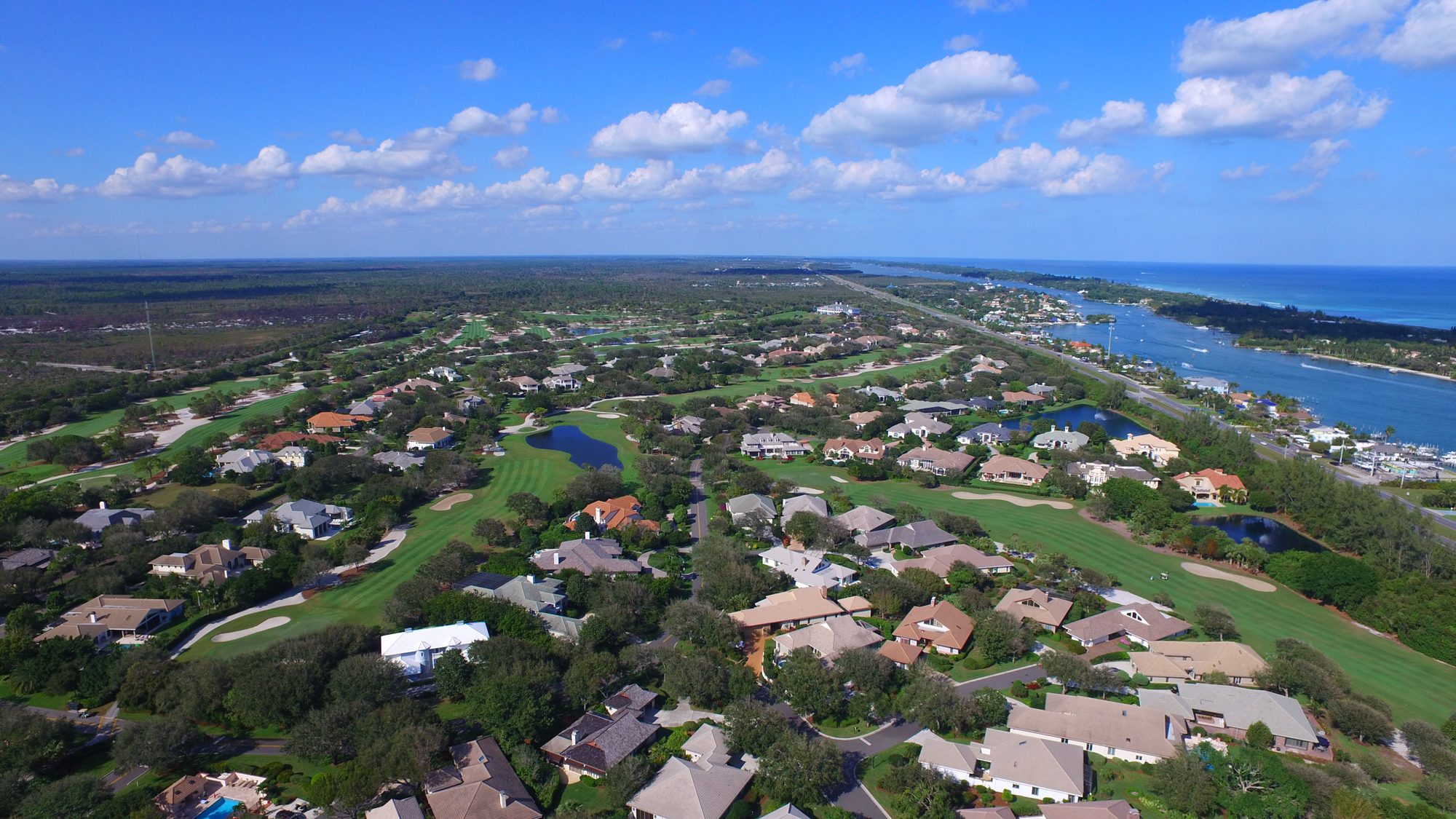 An island in a lake beside Jupiter Hills fairways and homes