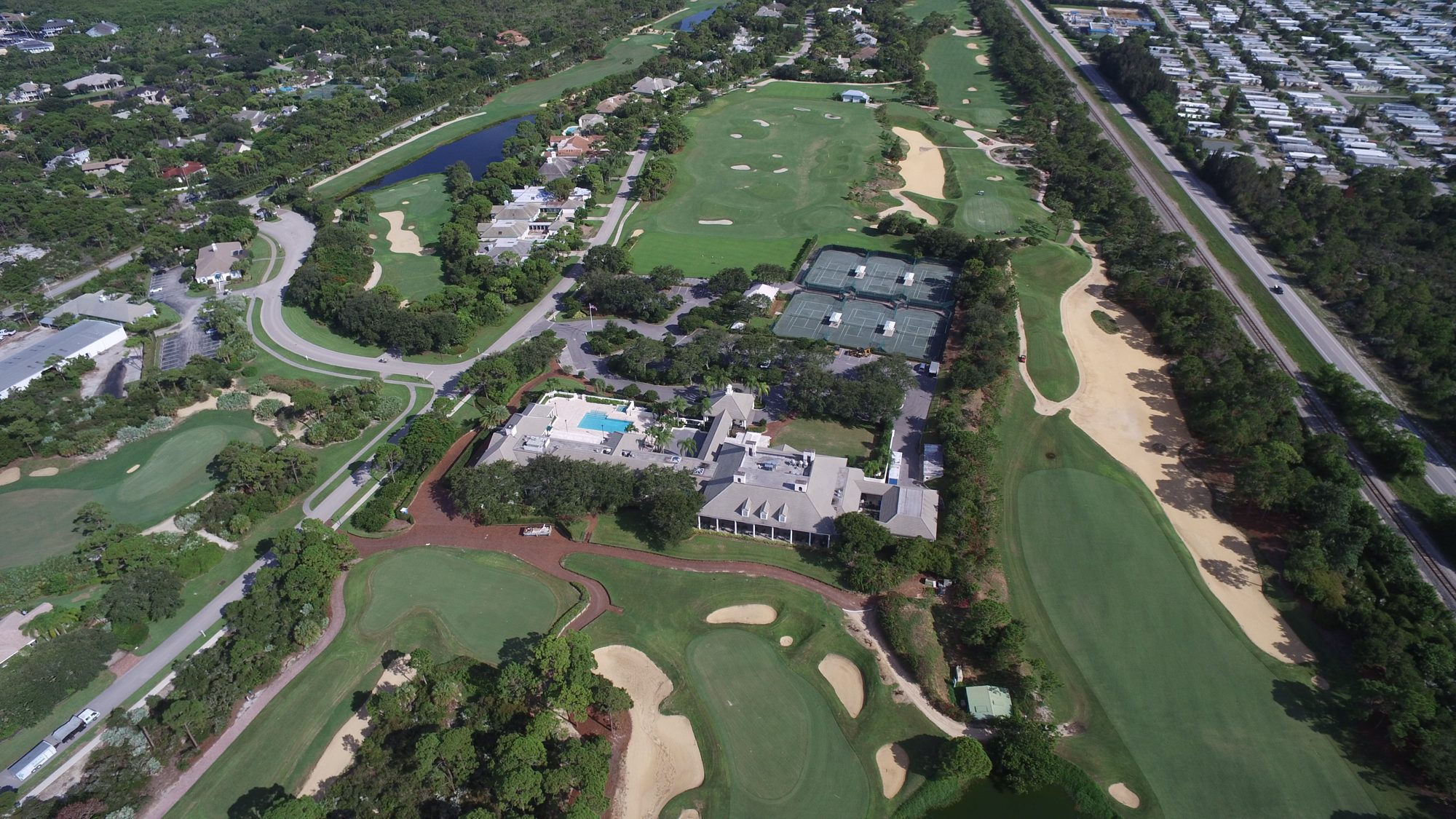 Loblolly fairways and homes in the pines with Jupiter Island and the ocean beyond