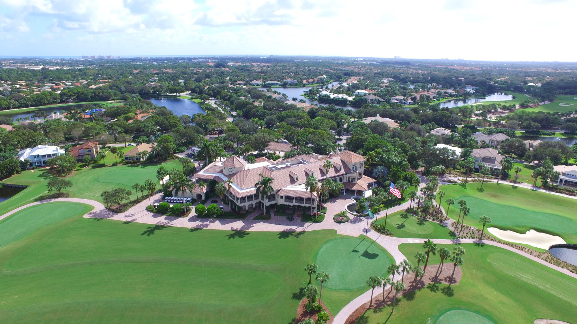 The Loxahatchee Club course and lakes with the ocean on the horizon