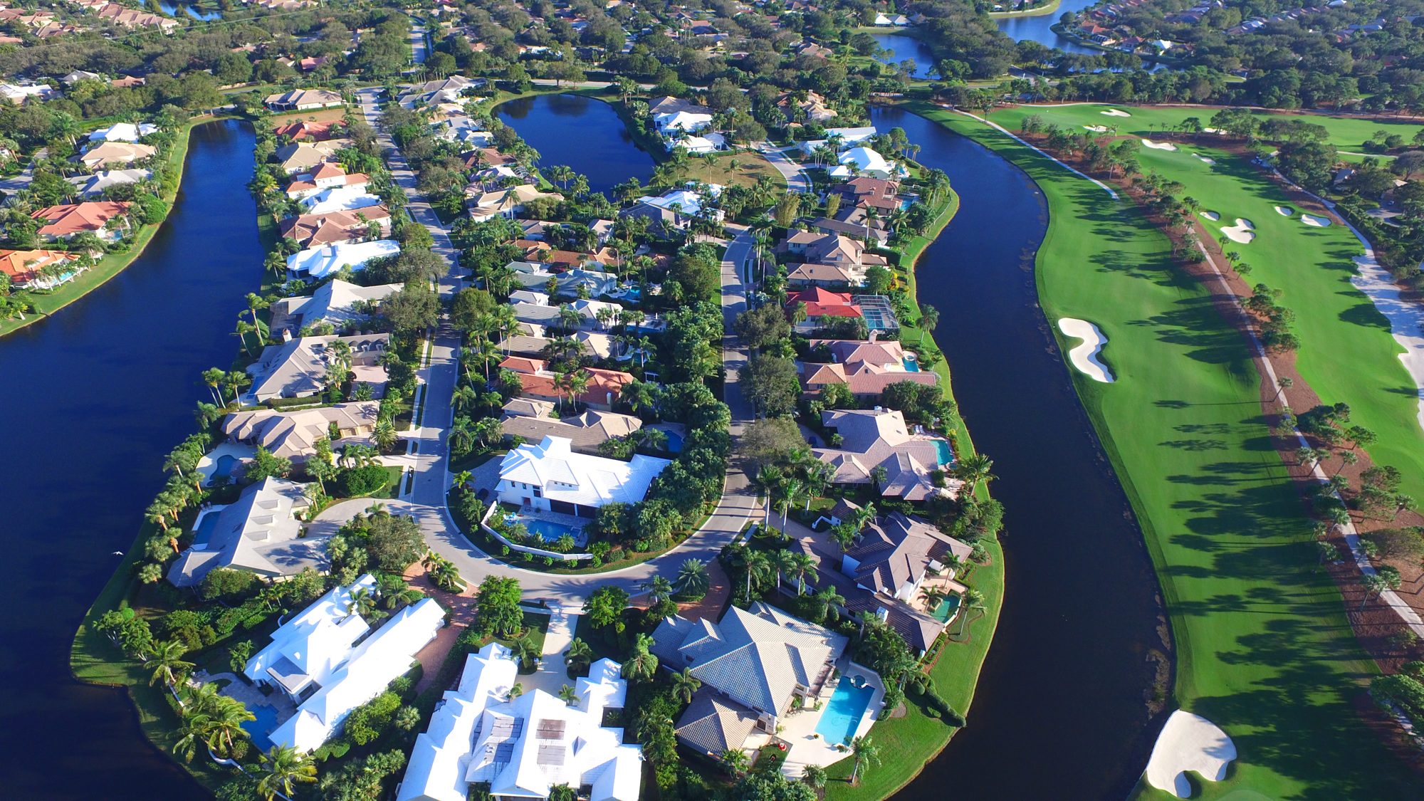 A peninsula of homes between lakes and a fairway