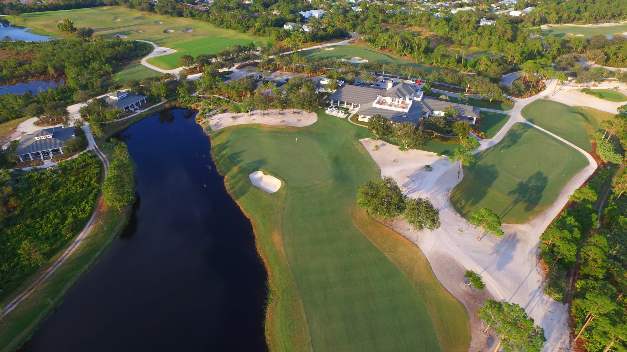 McArthur golf holes winding around a lake through pine and sand