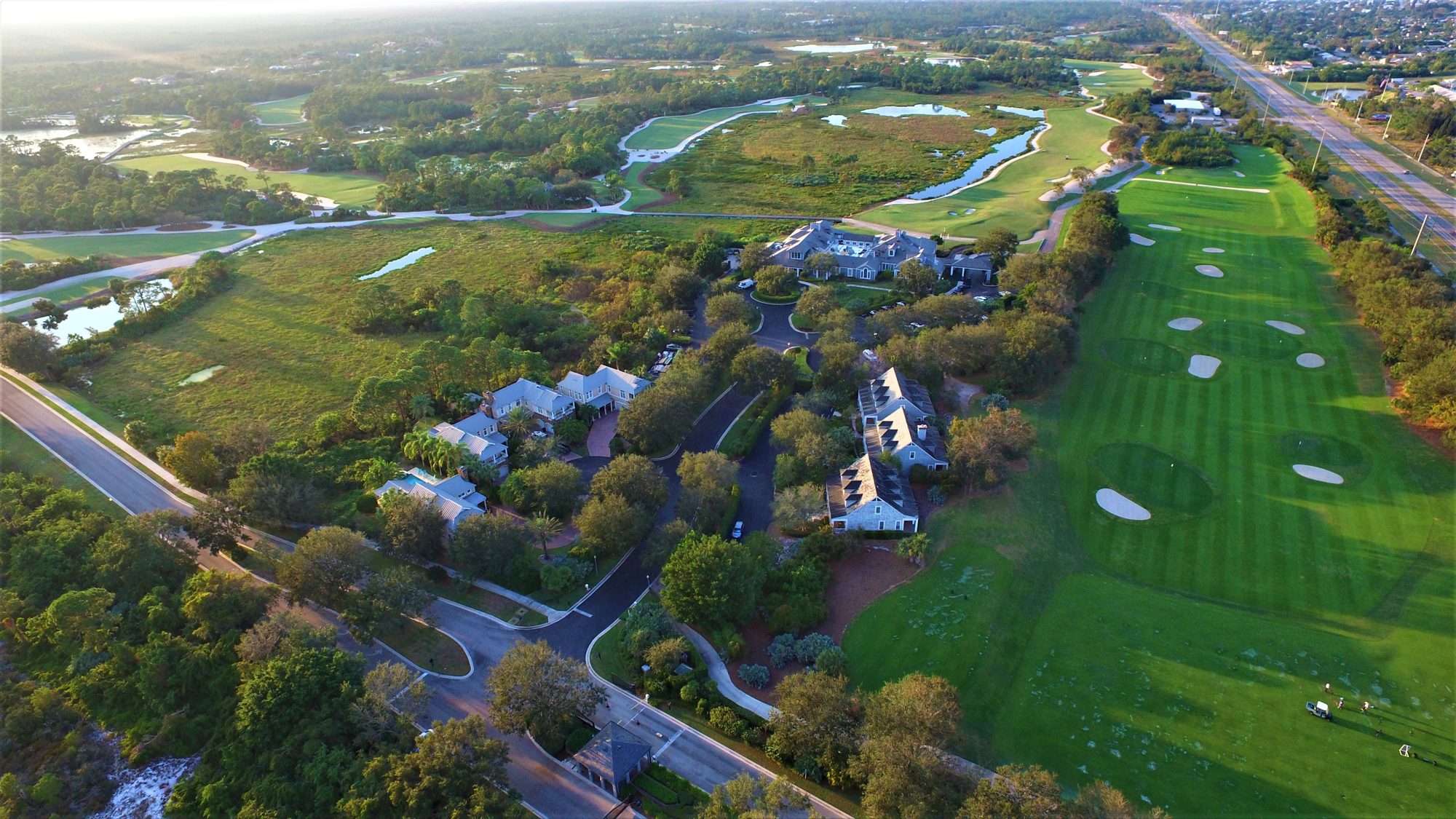 A Medalist fairway framed by sand, pines and a boardwalk