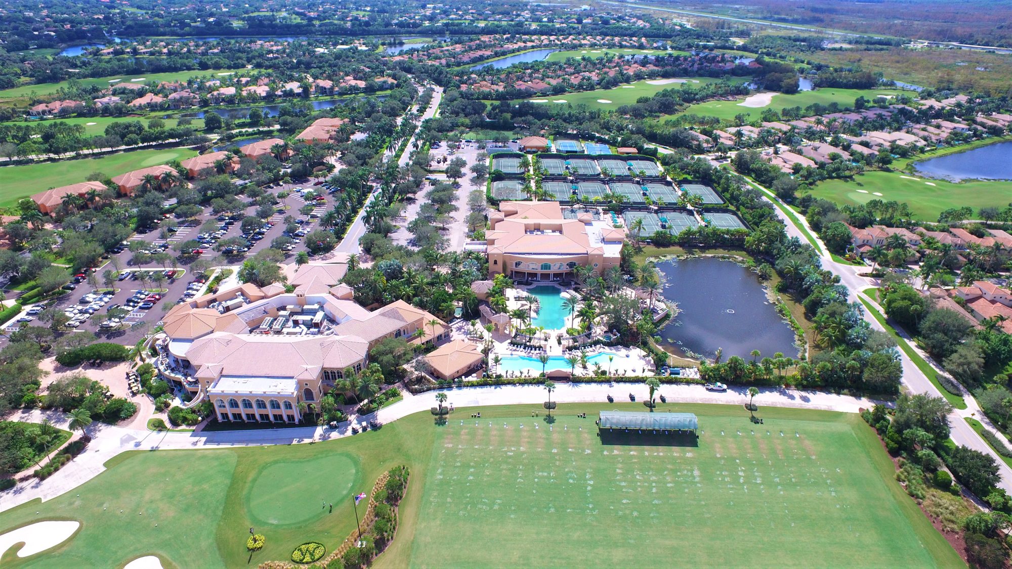 The Mirasol clubhouse, resort pool, tennis center and practice range