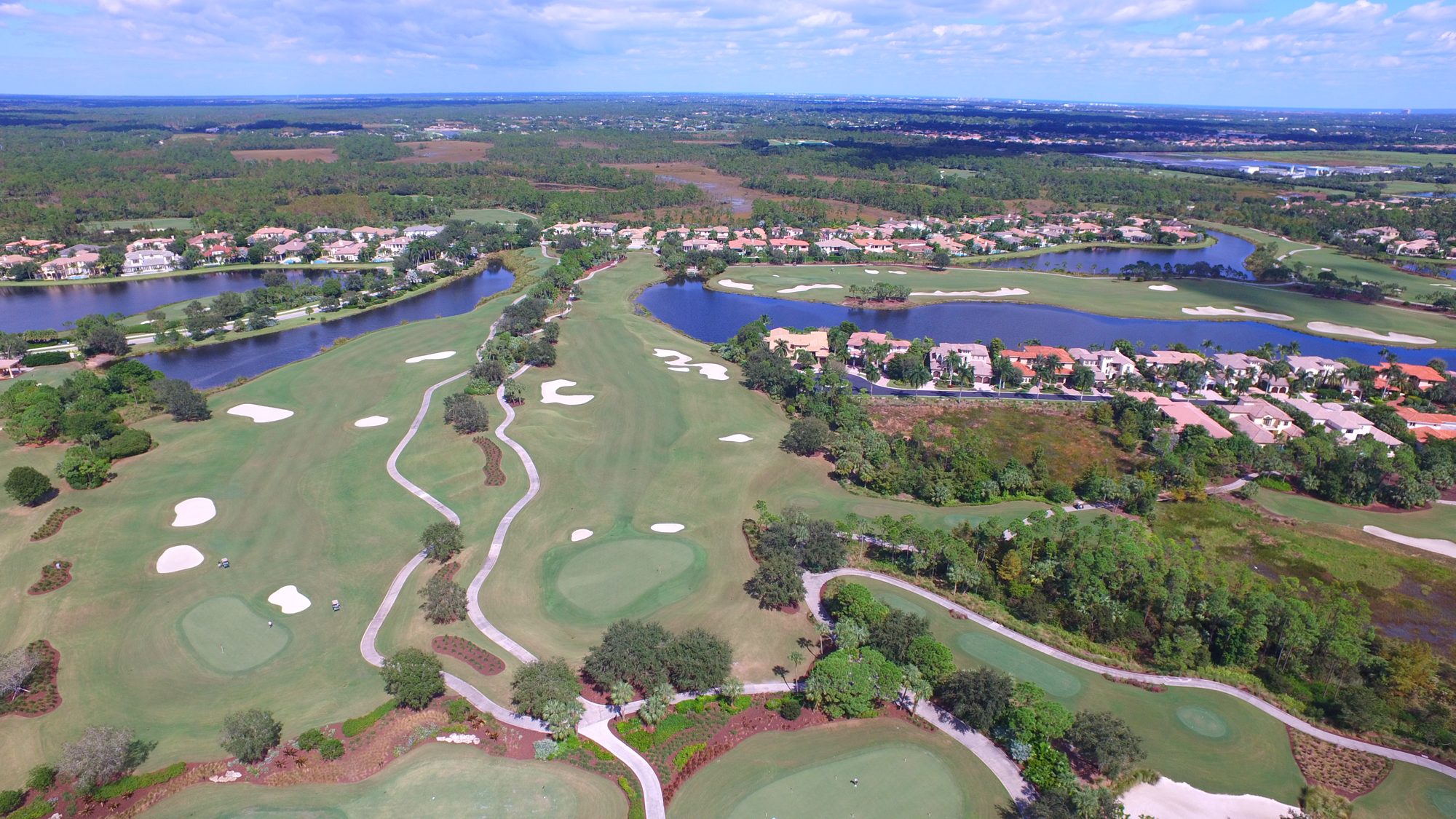 Mirasol fairways and greens between lakes and homes