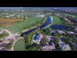 The Old Marsh clubhouse and finishing greens with the marsh beyond