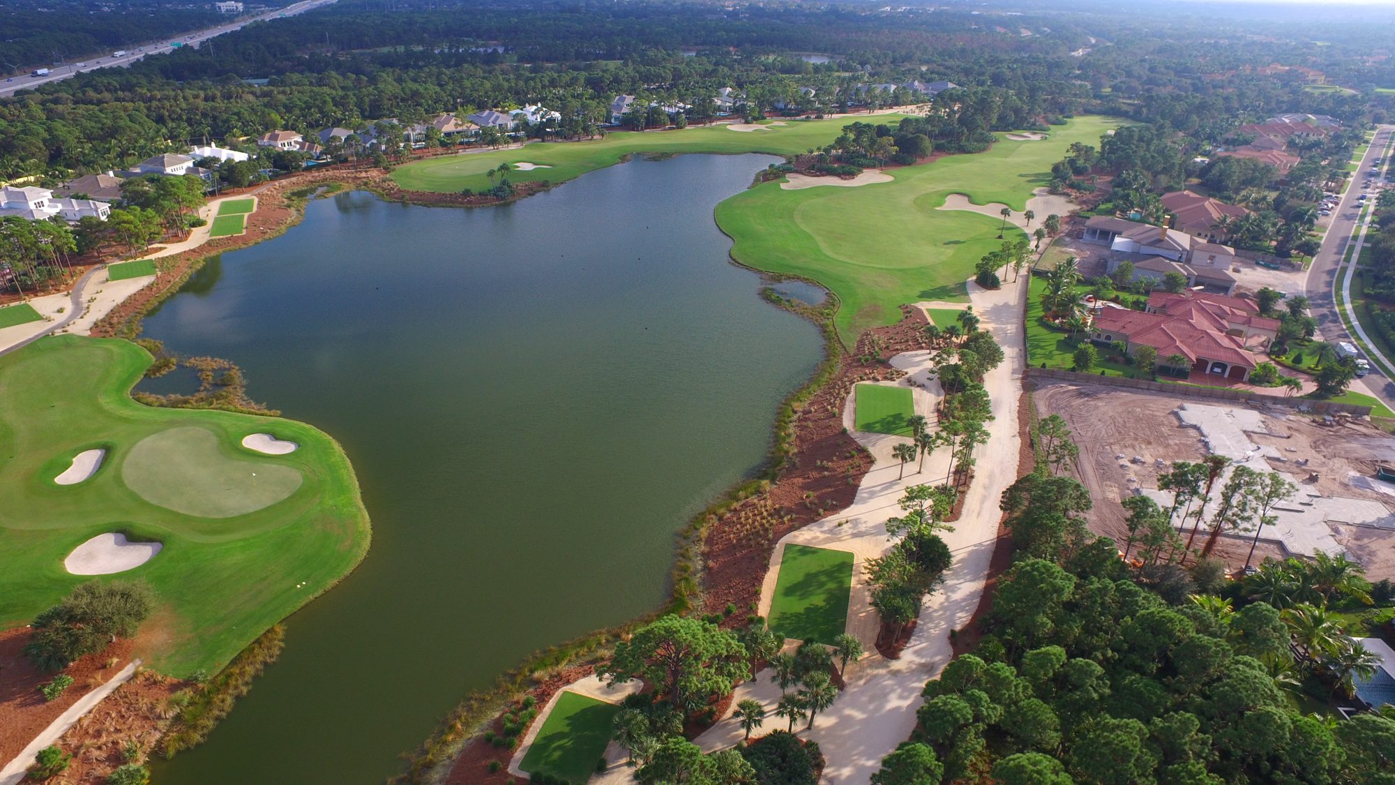 Pine-lined Old Palm fairways and estate homes from above