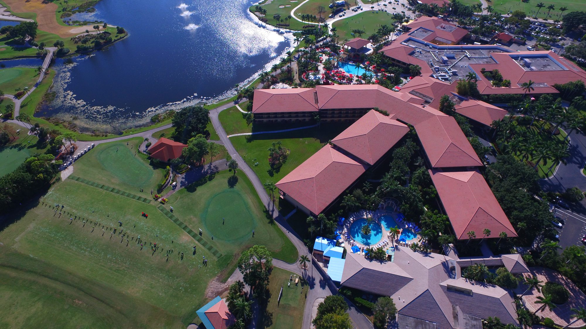 The PGA National resort, pools, practice range and lake from above
