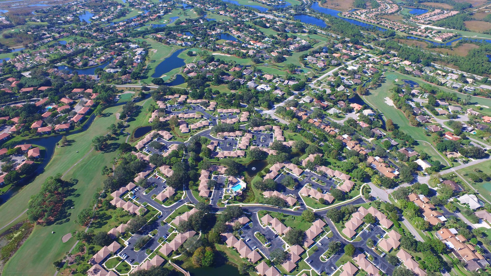 PGA National homes along fairways, lakes and greens under a big sky