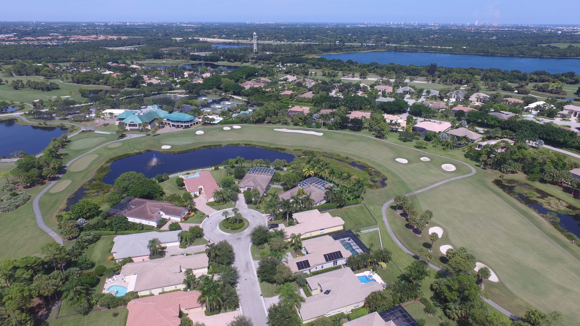An Iron Horse fairway along a lake lined with homes