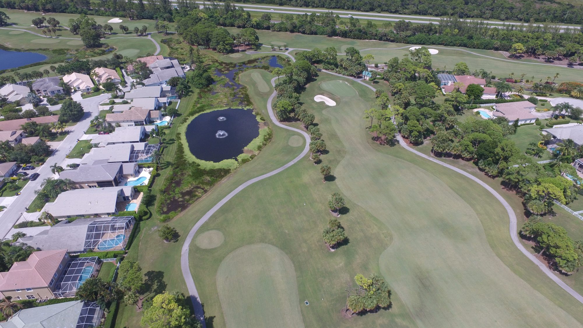 Iron Horse golf holes around a lake beside the preserve