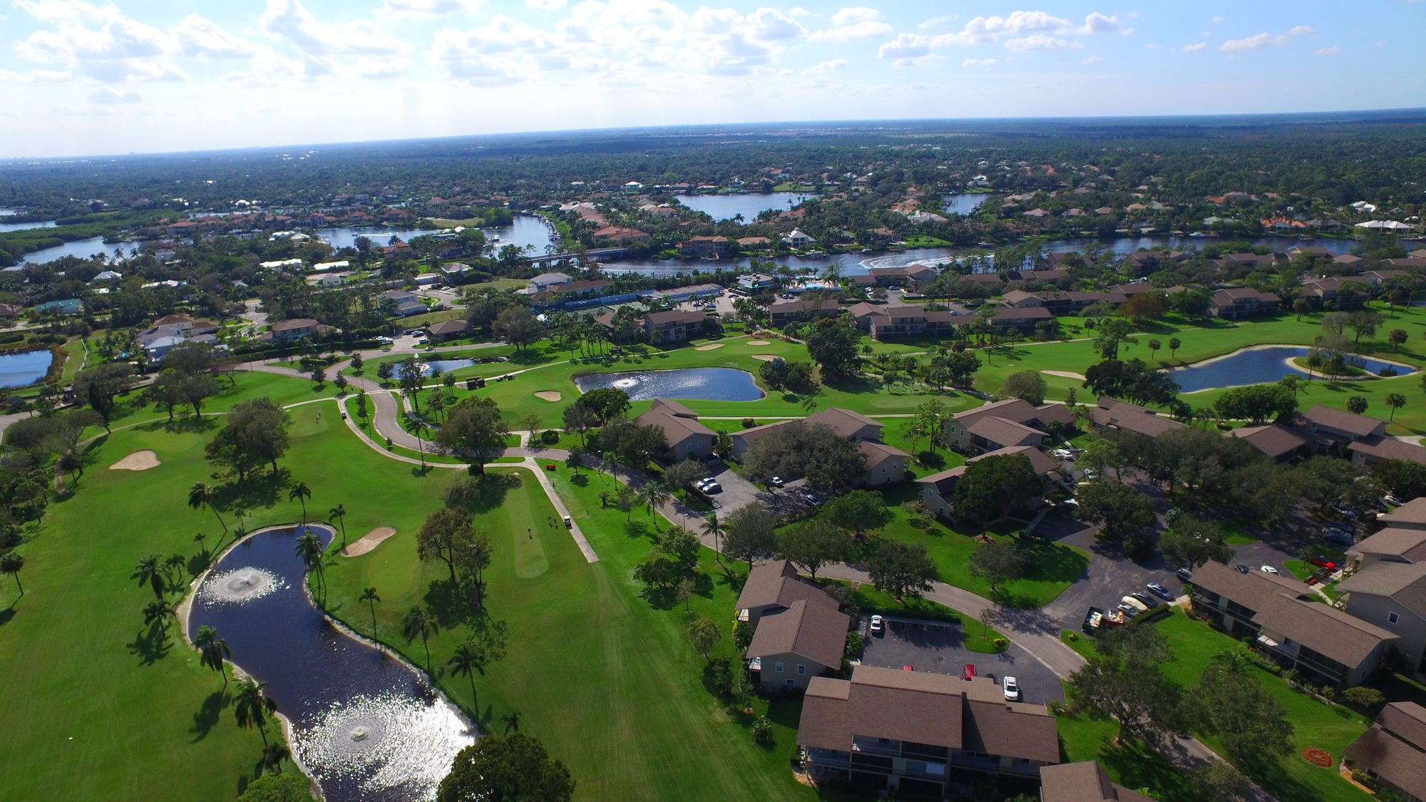 Riverbend residences overlooking an island pond and fairway