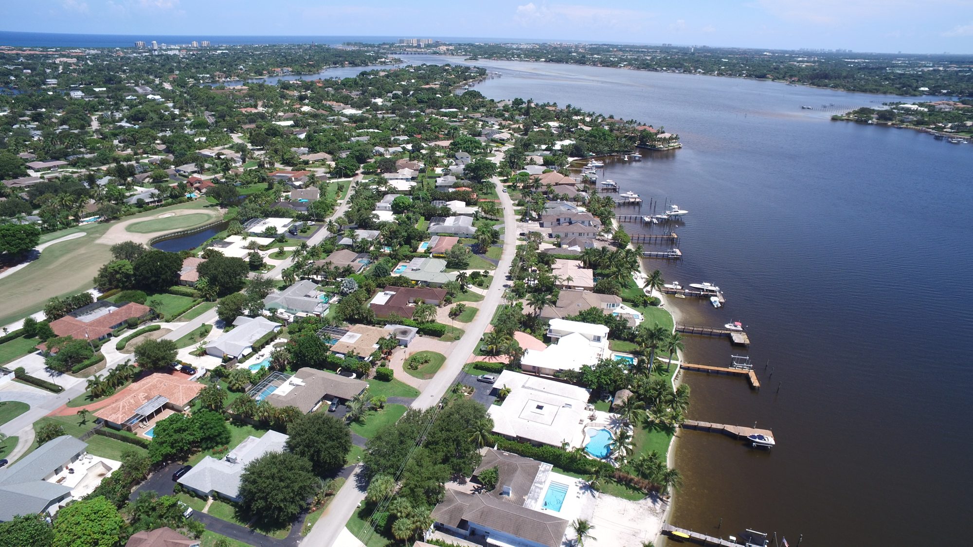 The club, course and waterfront homes beside the river
