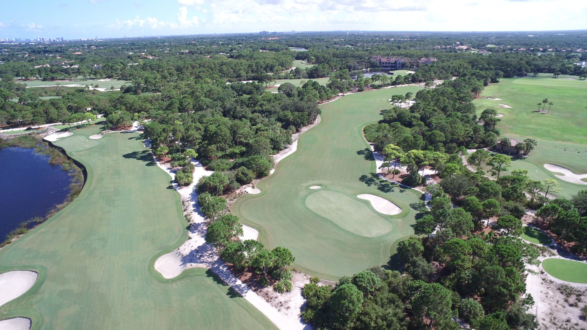 A Bears Club fairway leading toward lakes and estate homes