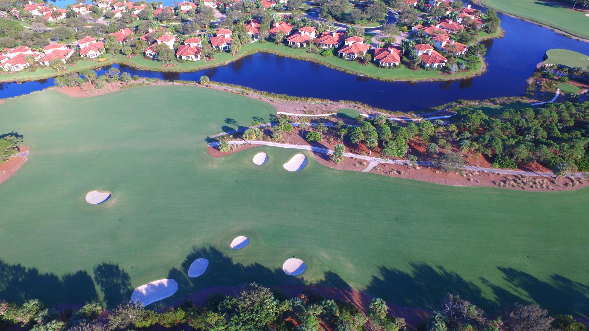 Trump National Jupiter homes between lakes and fairways with the Intracoastal beyond