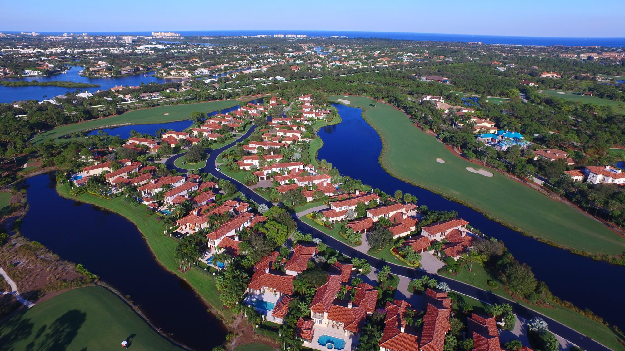 Homes on a peninsula between two lakes and fairways